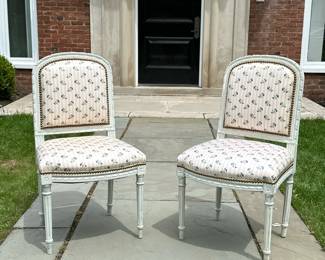 PAIR LOUIS XVI FRENCH GRAY CARVED SIDE CHAIRS UPHOLSTERED FLORAL STRIPED | Louis XVI chaise en cabriolet with gray-painted carved wood frame, upholstered floral and striped fabric. Tapered flute legs and peg feet. Brass nail head detailing. Seat height 18.5 in. - h. 34.75 x w. 20 x d. 16.5 in