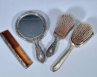 (4pc) Sterling Vanity Set And Additional Brush | Vanity set of matching brush, comb and mirror. Comb marked Gotham Sterling. Additional brush marked sterling as well and engraved with the letter “R”. - w. 1.75 x l. 7.5 in