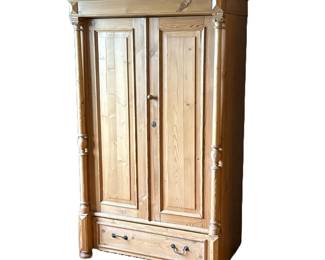 ANTIQUE LIGHT PINE DOUBLE DOOR ARMOIRE WARDROBE | Double door wardrobe with brass knob handles with a full-width drawer at the bottom with brass drop handles. Raised on bun feet. - h. 69.5 x w. 44.5 x l. 24.5 in (at crown molding)