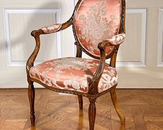 FLORAL UPHOLSTERED ROUND BACK CARVED WOOD FRENCH ARMCHAIR | Round back French carved armchair with floral upholstery and fluted carved legs - h. 37 x w. 24.5 x d. 19.5 in
