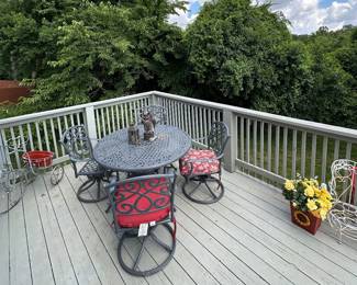 Patio furniture -  Large Round Table and 4 chairs, very heavy metal with a three cushions