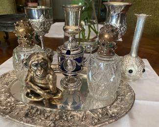 Russian silver monkey with Russian hallmarks., original LouieXVI 16th salt Holder with cobalt insert. Three fabulous Sterling goblets and a pair of Austrian crystal perfume holders with jewel tops as well as a sterling silver jewelry vase.