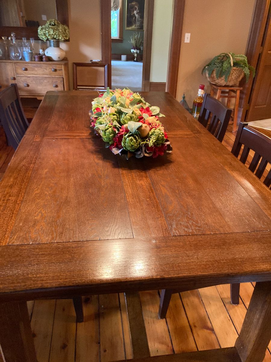 Vintage dining table with self storage leaf.