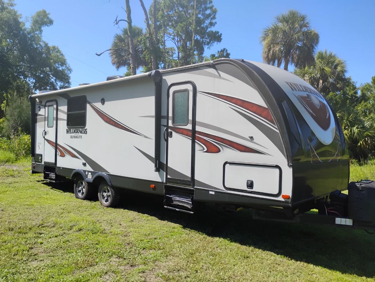 A Wilderness Ultralite Camper in Mint Condition --super clean light use. $12,000 asking. Comes with new in still in box GE Duel Fuel Generator with two new propane tanks