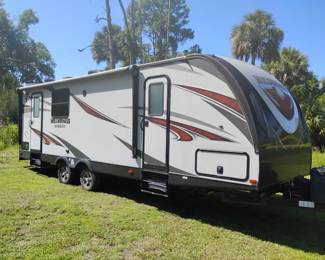 A Wilderness Ultralite Camper in Mint Condition --super clean light use. $16,000 asking. Comes with new in still in box GE Duel Fuel Generator with two new propane tanks