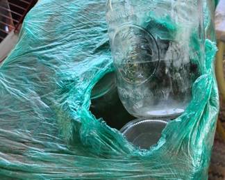 About six big bundles of new Mason Jars for jarring preserving