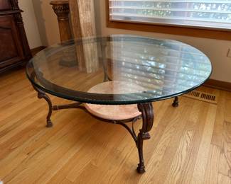 Round glass coffee table with metal base.....