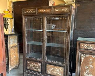 Vintage Chinese Rosewood glass display cabinet with detailed mother-of-pearl inlay. 59" tall. Dimensions are approximate. Qty: 2. Asking: $400 each