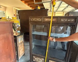 Vintage Chinese Rosewood glass display cabinet with detailed mother-of-pearl inlay. 59" tall. Dimensions are approximate. Qty: 2. Asking: $400 each