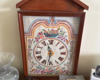 Wall clock with embroidered face