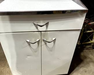 Metal cabinet with Formica top and chrome trim