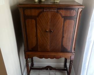 Vintage cabinet with open decorative back