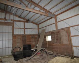 Barn items, including antique barbed wire panels on wall