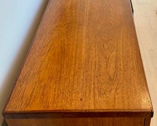 MCM Circa 1960's Bath Cabinet Makers Sideboard.
Bath Cabinet Makers African Teak & Rosewood Sideboard, sold through Heals of London. 1960s.
Beautifully crafted piece comprising of one opening door to the left and two to the right revealing capacious interiors with adjustable shelving. Between these four drawers with a cutlery drawer. Furnished with beautiful curved solid rosewood handles. A quality piece of furniture.