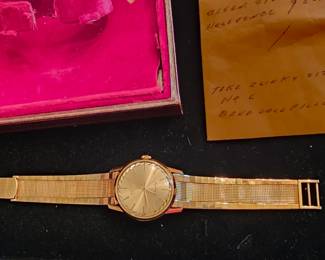vintage mint condition 60's Longines Flagship Men's 18k gold wristwatch with original band and case.
