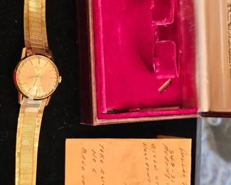 vintage mint condition 60's Longines Flagship Men's 18k gold wristwatch with original band and case.