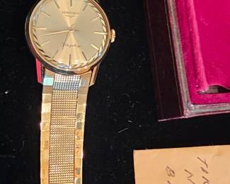 vintage mint condition 60's Longines Flagship Men's 18k gold wristwatch with original band and case.