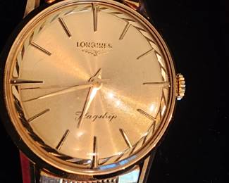 vintage mint condition 60's Longines Flagship Men's 18k gold wristwatch with original band and case.