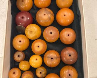 African Faturan trade beads, which are highly prized and often used for making prayer beads (komboloi). These beads were produced in Europe for the African trade, particularly in the early to mid-1900s, and have been traded in Africa for over 100 years.