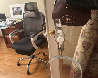 Very unique sculptural Karl Springer style desk or table lamp made of solid, heavy Lucite. The shape of the lamp is a thick circle sitting on top of a chunky rectangle Lucite base. This lamp is signed Marlee from a French artist, with nickel silver hardware. Very good, vintage condition..just needs a beautiful shade.

23h top of socket
31h top of shade
14w
6d 

HBADA OFFICE CHAIR WITH FOOT REST