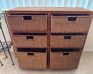 Storage cabinet with seagrass baskets