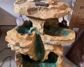 Fiberglass water feature with an amethyst stone
