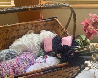 collection of knitting needles and basket