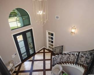 Hanging Huge Foyer Chandelier, metal, from the home where it came from in La Cantera.  