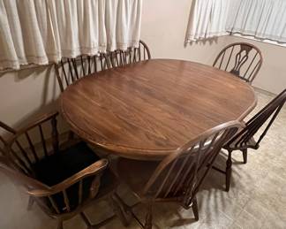 Dinning room table, 6 chairs ( 2 are arm chairs), 1 leaf, padded protective cover for top.