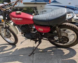 motorcycle Suzuki 250 title in hand.