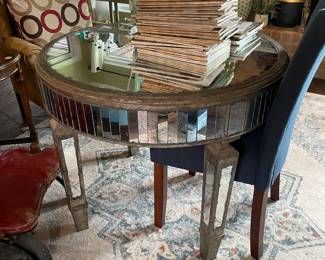 glass mirrored table and collectible magazines