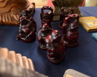 Set of carved red resin animal figurines
