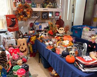 Holiday decorations and collectibles including pumpkins and sports-themed items