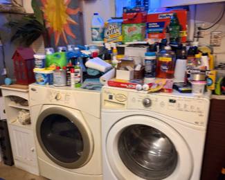 Front-load washer and dryer with Bud Light neon sign