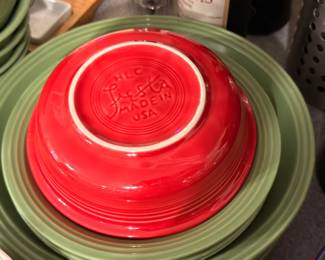 Vintage Fiesta mixing bowl (red) stacked on green dish