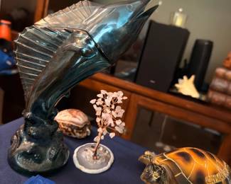 Marlin fish sculpture and turtle figurine with Game Boy cartridges