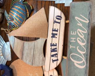 Wooden beach-themed signs reading 'Take Me to the Ocean'