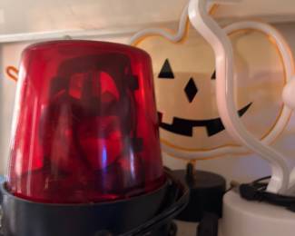 Red emergency light and ghost decoration
