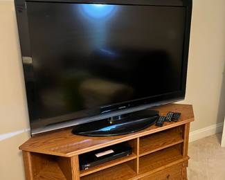 Huge Toshiba TV. 
Oak look TV stand
