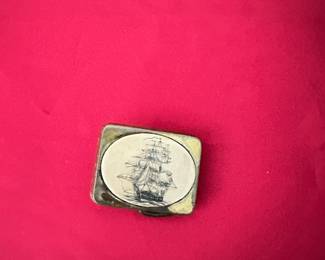 Scrimshaw belt buckle