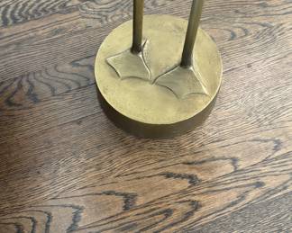 CB2 Brass Bird Outdoor Table close up on feet