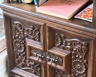 Storage at the bottom of the bookcase