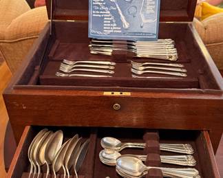 This is a beautiful Silverware box wit a set of silver plate flatware