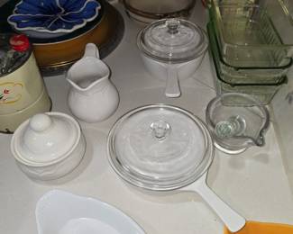 Small corning ware, glass mortar and pestle, white sugar and cream set, glass loaf pans