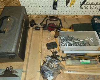 A few vintage tools, empty tool box, metal clipboard