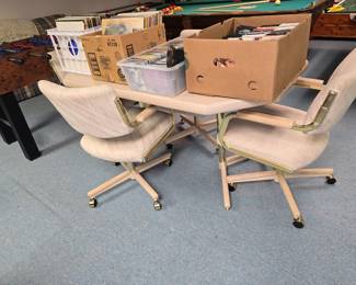 Nice table and 4 rolling chairs.