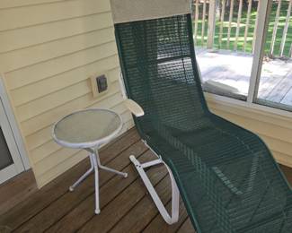 The matching lounge and white metal side table.
