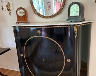 Ebonized 2 Door Credenza w/ Marble Top - Adorned w/ Gilt Metal Mounts, Carved Round Mirror, Shelf Clocks