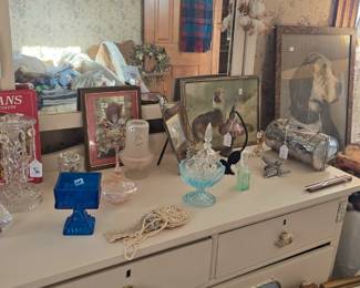 White bedroom furniture is in the last bedroom down the hallway and around the corner, next to the kitchen stairway.