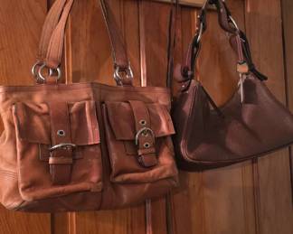 Coach on the left, Dooney Bourke on the right. Middle bedroom doorway.